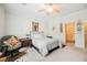 Bedroom with a ceiling fan, and an ensuite bathroom at 2388 Aztec Ruin Way, Henderson, NV 89044
