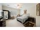A bedroom with a ceiling fan, neutral walls, and plush carpeting at 2388 Aztec Ruin Way, Henderson, NV 89044