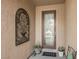 Inviting front entrance featuring a decorative glass door, stylish wall art, and neutral tones at 2388 Aztec Ruin Way, Henderson, NV 89044