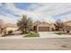 Charming home with a two-car garage, beautiful landscaping, and a well-manicured lawn at 2388 Aztec Ruin Way, Henderson, NV 89044