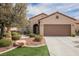 Charming single-story home featuring a well-manicured lawn, desert landscaping and a two-car garage at 2388 Aztec Ruin Way, Henderson, NV 89044