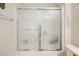 Bathroom shower featuring glass doors and tile flooring at 2388 Aztec Ruin Way, Henderson, NV 89044