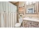 Cozy bathroom featuring a decorative vanity and rustic-style shelving unit at 2540 Eagle St, Las Vegas, NV 89142