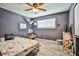 bedroom featuring colorful space-themed décor and wood-look flooring at 2540 Eagle St, Las Vegas, NV 89142