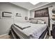 The converted shed has been outfitted as a bonus room including a bed and a mini fridge at 2540 Eagle St, Las Vegas, NV 89142