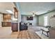 Open-concept living area with a blend of tile and wood flooring at 2540 Eagle St, Las Vegas, NV 89142