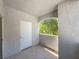 Balcony featuring textured walls and floor, with an arched opening to view the surrounding trees at 2615 W Gary Ave # 2051, Las Vegas, NV 89123