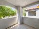 Balcony featuring textured walls and floor, and views of surrounding trees and building at 2615 W Gary Ave # 2051, Las Vegas, NV 89123