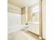 Bright bathroom featuring a shower-tub combo, vanity, and neutral tile flooring at 2615 W Gary Ave # 2051, Las Vegas, NV 89123