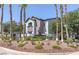 Exterior of an apartment complex with mature trees and desert landscaping at 2615 W Gary Ave # 2051, Las Vegas, NV 89123