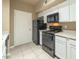 A well-lit kitchen with black appliances and light cabinets at 2615 W Gary Ave # 2051, Las Vegas, NV 89123
