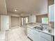Kitchen featuring laminate countertops, stainless steel sink, and tile floors at 2615 W Gary Ave # 2051, Las Vegas, NV 89123