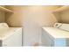 Laundry area featuring side-by-side washer and dryer hookups with shelving above at 2615 W Gary Ave # 2051, Las Vegas, NV 89123