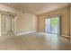 Inviting living room with sliding glass doors and neutral tile flooring at 2615 W Gary Ave # 2051, Las Vegas, NV 89123