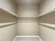 Empty walk-in closet with shelving and neutral color palette at 2615 W Gary Ave # 2051, Las Vegas, NV 89123