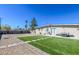 A well-maintained backyard with green turf and a patio set, ideal for outdoor relaxation and entertainment at 2990 La Canada St, Las Vegas, NV 89169