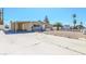 Charming single-story home featuring a spacious driveway and minimalist desert landscaping at 2990 La Canada St, Las Vegas, NV 89169