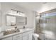 Modern bathroom featuring a white vanity, marble countertop, and glass-enclosed shower at 3009 Anna Bay Dr, Las Vegas, NV 89134