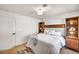 Cozy bedroom features a comfortable bed with stylish wood built-in bookshelves and soft lighting at 3009 Anna Bay Dr, Las Vegas, NV 89134