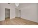 Bedroom with light-colored hardwood floors and contemporary chandelier at 3009 Anna Bay Dr, Las Vegas, NV 89134