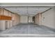 Spacious garage with ample storage cabinets along both sides of the wall and bright overhead lighting at 3009 Anna Bay Dr, Las Vegas, NV 89134