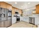 Beautiful kitchen featuring stainless steel appliances, updated cabinets, marble countertops, and a spacious island at 3009 Anna Bay Dr, Las Vegas, NV 89134