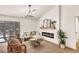 Bright living room featuring modern decor, light wood floors, and an electric fireplace at 3009 Anna Bay Dr, Las Vegas, NV 89134