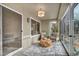 Inviting sunroom with cozy seating, a modern rug, and plenty of natural light at 3009 Anna Bay Dr, Las Vegas, NV 89134