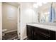 Bathroom featuring a granite countertop vanity, modern fixtures, and access to a private toilet area at 3096 Beaux Art Ave, Henderson, NV 89044