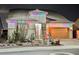 Charming single-story home adorned with festive multi-colored holiday lights at 3096 Beaux Art Ave, Henderson, NV 89044