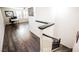 Hallway area with stairs and luxury vinyl flooring, leading to a room with great natural light at 3096 Beaux Art Ave, Henderson, NV 89044