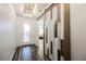Entryway featuring a modern sliding barn door with decorative ceiling light and plank flooring at 3096 Beaux Art Ave, Henderson, NV 89044