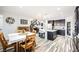 Open concept kitchen with dark wood cabinets, island seating and stylish flooring at 3096 Beaux Art Ave, Henderson, NV 89044