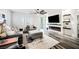 Inviting living room with modern fireplace, ceiling fan, and sleek flooring at 3096 Beaux Art Ave, Henderson, NV 89044