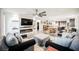 Open-concept living space featuring a fireplace, dining area, and stylish decor at 3096 Beaux Art Ave, Henderson, NV 89044