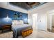 Bright primary bedroom with a tray ceiling, fan, and wood-look floors at 3096 Beaux Art Ave, Henderson, NV 89044
