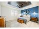 Serene primary bedroom features a ceiling fan and a stylish accent wall at 3096 Beaux Art Ave, Henderson, NV 89044