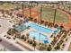 An aerial view of the pool area with a recreation building and a well-manicured baseball field nearby at 3096 Beaux Art Ave, Henderson, NV 89044
