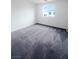 Bedroom featuring a window with views and neutral carpeting at 3610 Tripoli Cove Ave, Las Vegas, NV 89106
