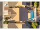 An aerial view of a single Gathering home, highlighting the backyard pool and desert landscaping at 364 Rushing Creek Ct, Henderson, NV 89014