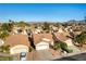 Aerial view of neighborhood homes with lush landscaping and a mountain backdrop at 364 Rushing Creek Ct, Henderson, NV 89014