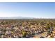 Expansive aerial view of a vibrant city skyline surrounded by a thriving residential community at 364 Rushing Creek Ct, Henderson, NV 89014