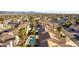 Scenic aerial shot of a neighborhood featuring lush trees and distant mountain views at 364 Rushing Creek Ct, Henderson, NV 89014