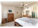 Bright bedroom featuring a wooden bed frame and ensuite bathroom at 364 Rushing Creek Ct, Henderson, NV 89014