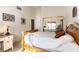 Sunny bedroom featuring a wooden bed frame and a sliding-door closet at 364 Rushing Creek Ct, Henderson, NV 89014
