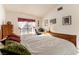Cozy bedroom featuring a wooden bed frame and natural light at 364 Rushing Creek Ct, Henderson, NV 89014