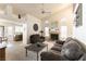 Spacious living area featuring vaulted ceilings, a fireplace, and an open-concept design at 364 Rushing Creek Ct, Henderson, NV 89014