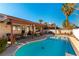 Inviting backyard pool with covered patio and outdoor seating area, perfect for entertaining at 364 Rushing Creek Ct, Henderson, NV 89014