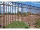 Desert landscaping and wrought iron fence offering unobstructed view of surrounding terrain at 3841 Budenny Dr, Las Vegas, NV 89122