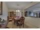 Formal dining area showcasing a wooden table, stylish furnishings, and bright lighting at 3841 Budenny Dr, Las Vegas, NV 89122